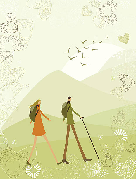 Hiking and trekking couple against a mountain landscape.
