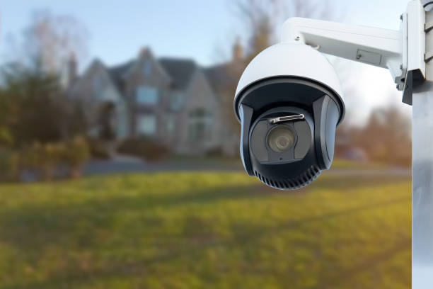 istock CCTV Camera with house in background. Close-up. 1657427528