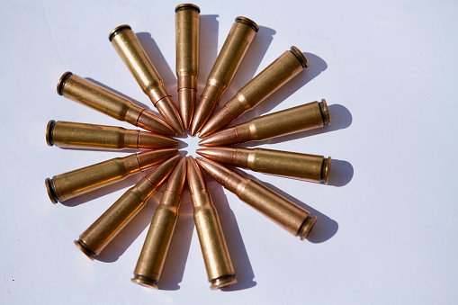 Bullet isolated on black background with reflexion. Rifle bullets close-up on black back. Cartridges for rifle and carbine on a black.