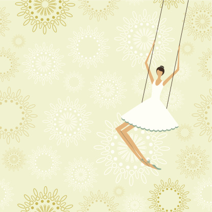 Ballerina swinging in a circus trapeze.