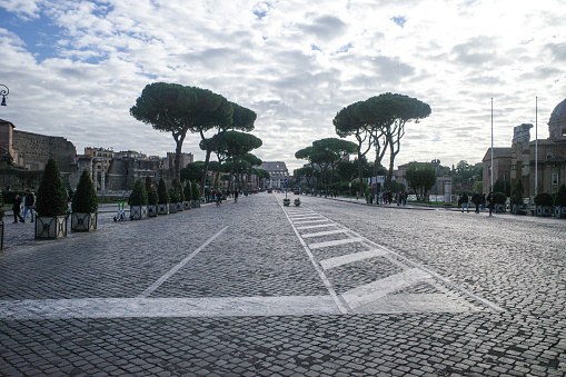 Rome, Italy - 27 Nov, 2022: Views of the Roman Colosseum along the Via Dei Fori Imperiali