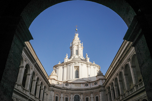 Rome, Italy - 26 Nov, 2022: Interior Courtyard of the Palazzo della Sapienza and the Church of Saint Yves