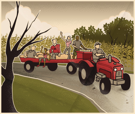 A vintage art deco style image of an early autumn hay ride through the country.
