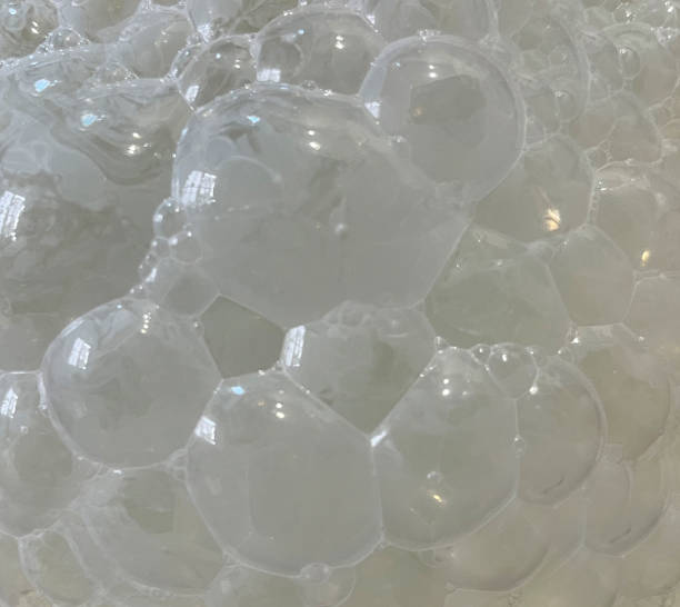 istock Closeup of large shiny foamy white milk bubbles 1657511839