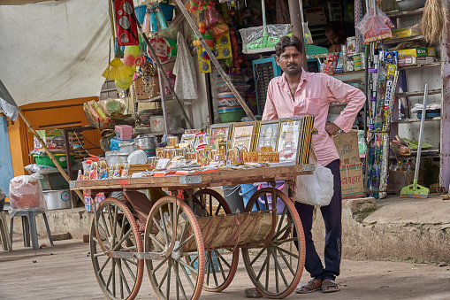 Khatu, India; 09-04-2023 : An indian man is selling things on a cart