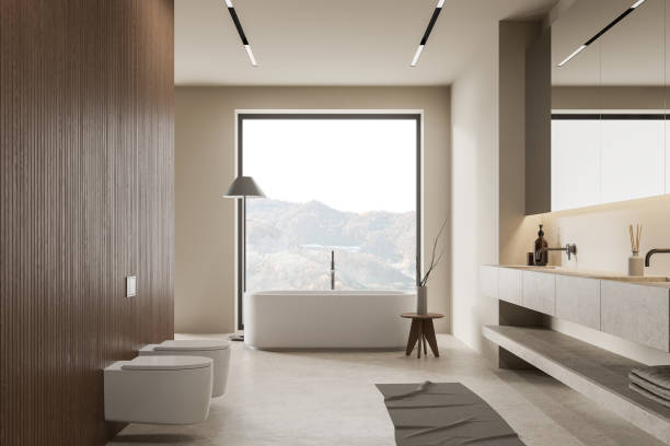 istock Modern bathroom interior with sink, toilet and bathtub near panoramic window 1657525098