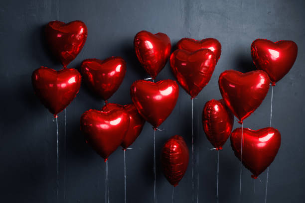 istock red heart balloons on dark background 1657528854