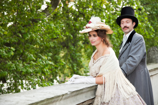 Costume themed Victorian couple on the balcony of Somerset House in London, UK. Taken in London at WPO Istock event with Canon 5D Mark2 