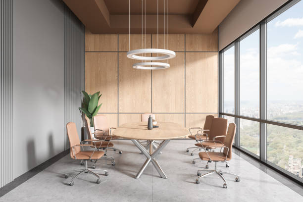 istock Modern meeting room interior with table and chairs, decoration and window 1657559208