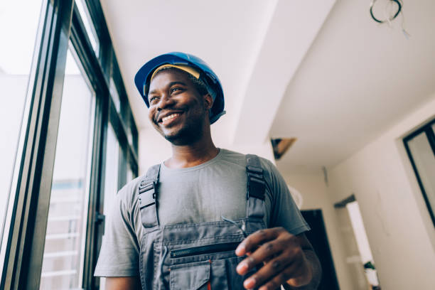 istock Portrait of a Smiling Construction Worker Looking Away 1657566596