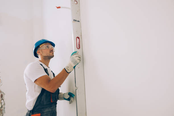 istock Caucasian Construction Worker Checking the Level Measurements inside an Apartment 1657567144