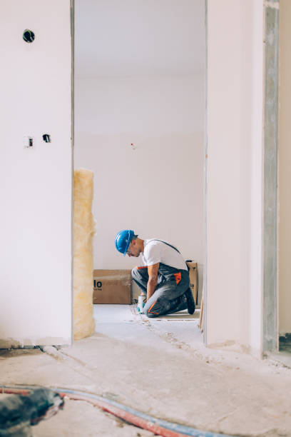 istock Caucasian Worker Doing Floor Reconstruction in an Apartment 1657567161