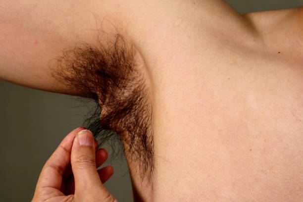 istock Naked man touching armpit hair 1657581970