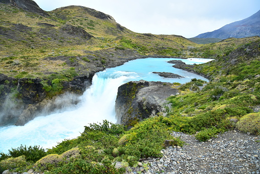 A river flows over a waterfall in Torres del Paine National Park.