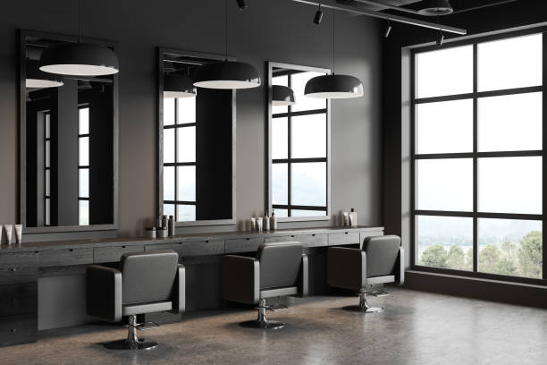istock Grey barbershop with armchairs and table with mirrors, panoramic window 1657589936