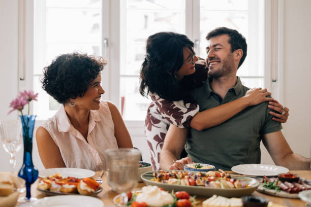 istock Three Friends Enjoying Lunch Together in a Bright Dining Room 1657592154