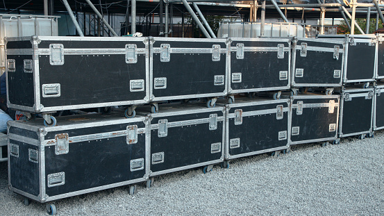 Two rows of black transport boxes