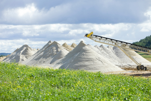 Piles of frac sand at the end of a conveyor at a new Wisconsin mine. 