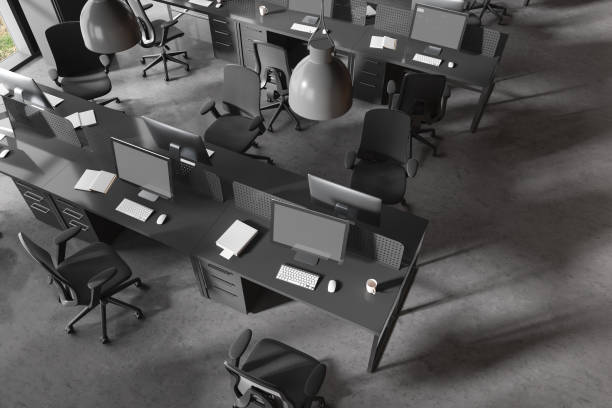 istock Top view of coworking interior with pc computer and armchairs in row 1657602973