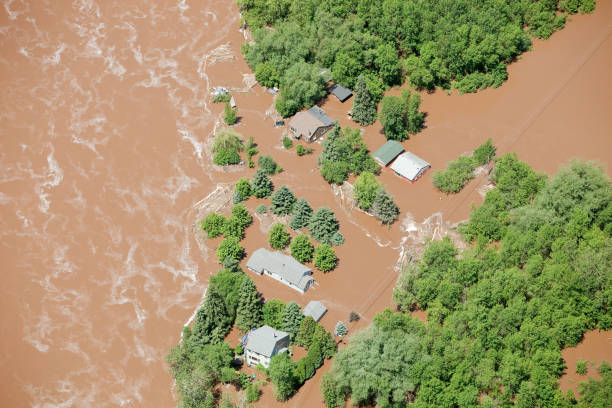 istock Muddy Floodwater Surrounds Homes 165760541