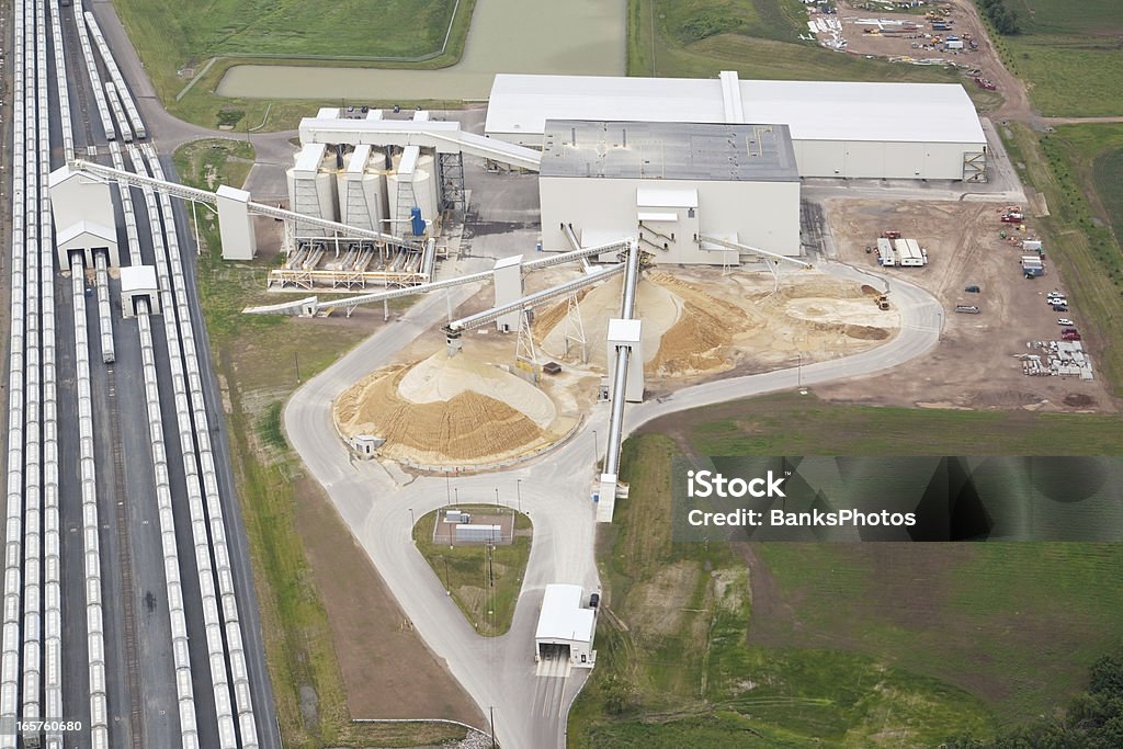 Wisconsin Frac Sand Processing Facility This is an aerial view of a northwestern Wisconsin frac sand processing operation. Trucks from area mines enter the facility through the scale house at the bottom. The sand is screened and sorted then loaded into rail cars for distribution. Shot from the open window of a small plane. http://www.banksphotos.com/LightboxBanners/Aerial.jpg Mining - Natural Resources Stock Photo