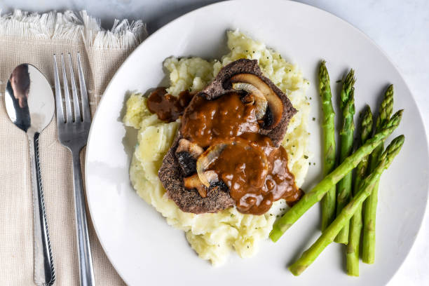 istock steak top with mushrooms and onions  on mash potatoes 1657618034