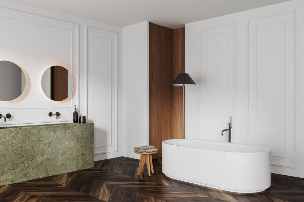 istock White bathroom interior with bathtub, double sink and minimalist decoration 1657623330