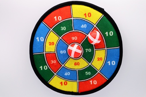 Dartboard isolated on white background. Vertical composition with copy space. Clipping path is included.