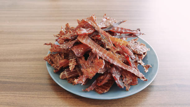 istock Ready-made homemade chicken slices in a dehydrator. Jerky. Close-up 1657626952