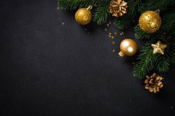 istock Black christmas background with fir tree and holiday decorations. 1657627568