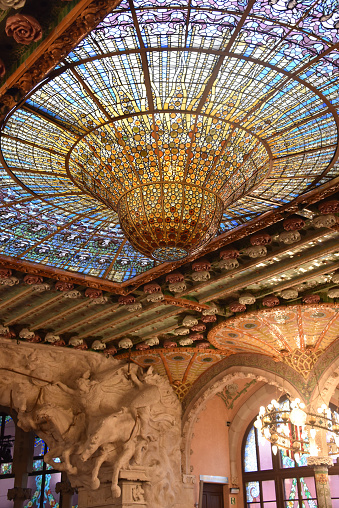 Barcelona, Spain - 23 Nov, 2021: Stained-glass dome ceiling Palau de la Música Catalana concert hall interior view, Barcelona, Catalonia, Spain