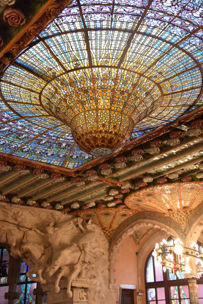 Barcelona, Spain - 23 Nov, 2021: Stained-glass dome ceiling Palau de la Música Catalana concert hall interior view, Barcelona, Catalonia, Spain Barcelona, Spain - 23 Nov, 2021: Stained-glass dome ceiling Palau de la Música Catalana concert hall interior view, Barcelona, Catalonia, Spain música stock pictures, royalty-free photos & images