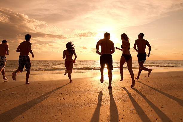 istock Multi ethnic friends having fun at the beach 165764365