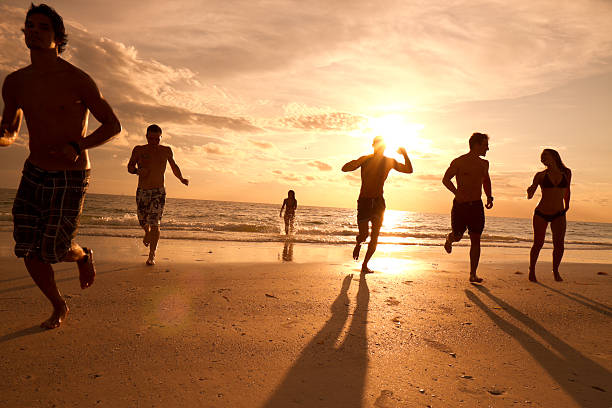 istock Multi ethnic friends having fun at the beach 165764576