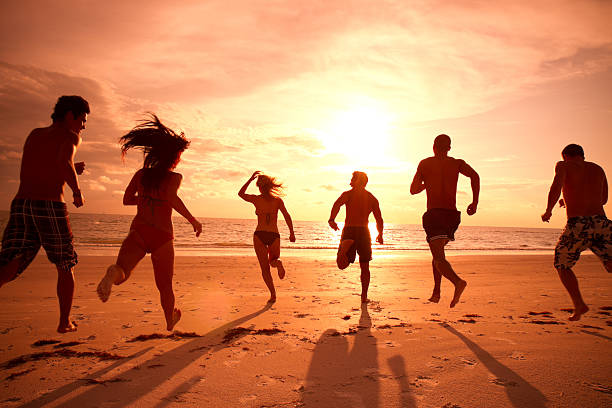 istock Multi ethnic friends running to the ocean 165764998