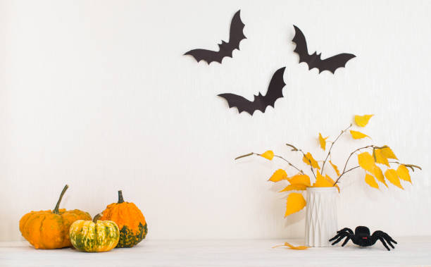 istock Halloween background with copy space. Decorative interior mockup with pumpkins bats spider and autumn leaves. 1657650374