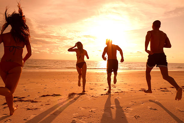 istock Multi ethnic friends running on the beach 165765043
