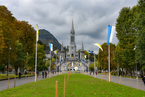 Lourdes, France - 9 Oct 2021: Exterior of the famous Sanctuaries Notre-Dame de Lourdes Cathedral