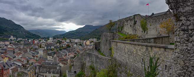 Lourdes, France - 9 Oct 2021: Views over the town of Lourdes from the Chateau Fort Museum of the Pyrenees