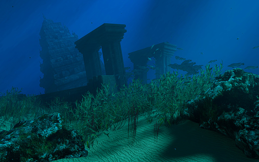 An ancient castle or ruin. An ancient city submerged underwater. An old castle or temple under the sea. Schools of underwater fish swim around the Lost City. 3D Rendering