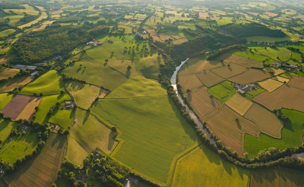 istock Aerial vista over patchwork green fields idyllic rural landscape 165767858