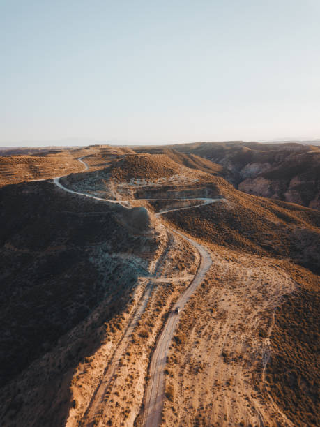 istock Dust and Dreams: Electric Car Drives through Gorafe Desert's Stunning Canyons 1657681905