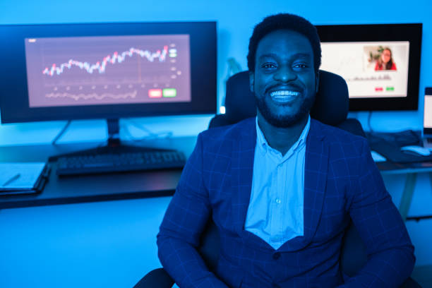 istock Young expert investor smiling after doing his finances online and evaluating the graphs. Concept: Entrepreneurship, investor, business 1657687803