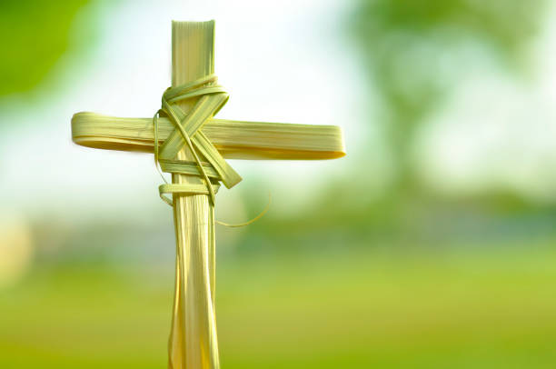 Cross made out of palm fronds. stock photo