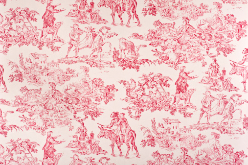 Antique red toile fabric containing images of life during the 1800's. Fabric depicts men hunting, women sitting in the fields, a farm house, dogs, women working.