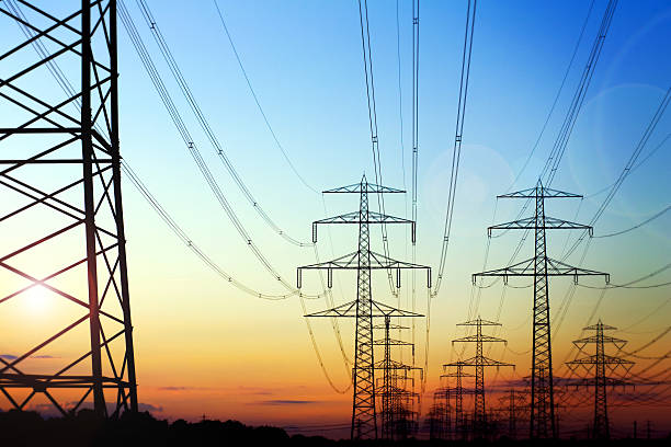 istock High voltage pylons in the evening sun 165774254