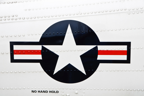 On January 14, 1947,.a horizontal red stripe, centered on the white horizontal bar, was added to the National Aircraft Insignia. This insignia which remains current today was photographed on the side on a Coast Guard Helicopter
