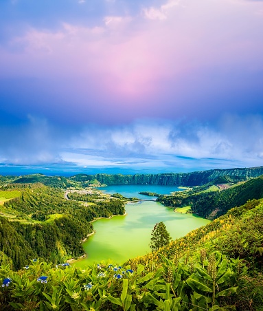 Nestled in the heart of the Azores archipelago in Portugal, Lagoa das Sete Cidades is a place that seems plucked right out of a fairy tale. This enchanting destination is renowned for its awe-inspiring beauty, featuring two pristine lakes, one blue and one green, nestled within the crater of a dormant volcano.\n\nThe name \