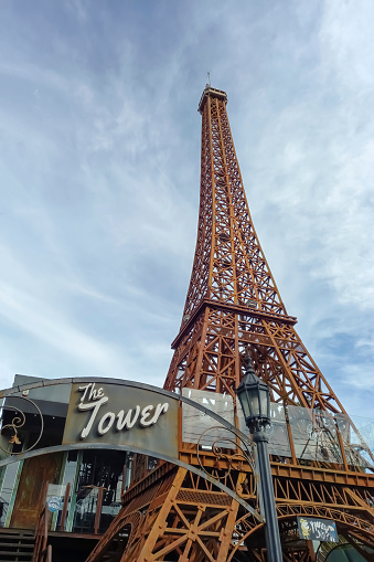 Ituzaingo, Argentina - Jul 29, 2023: Replica of the Eiffel tower, artwork by Ruben Diaz, at the entrance of a beer house in Ituzaingo, Buenos Aires Province, Argentina. Copyspace