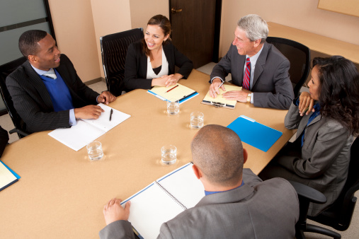 Business people in a conference room.View More. 